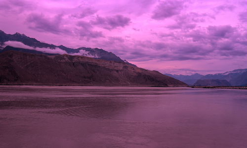 Scenic view of mountains against sky during sunset