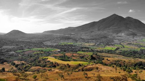 Scenic view of landscape and mountains against sky