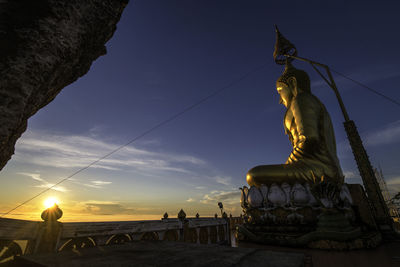 Low angle view of statue against sky during sunset