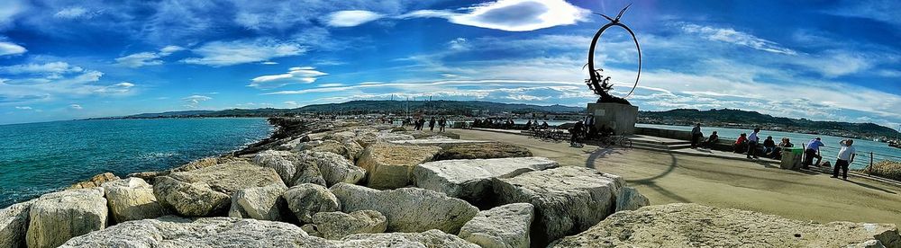 Scenic view of sea against cloudy sky