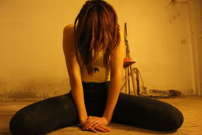 Rear view of woman standing at home