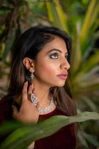 Young woman wearing traditional clothing standing outdoors