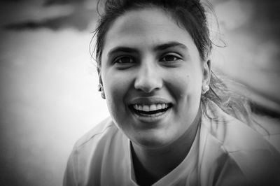 Close-up portrait of a smiling young woman