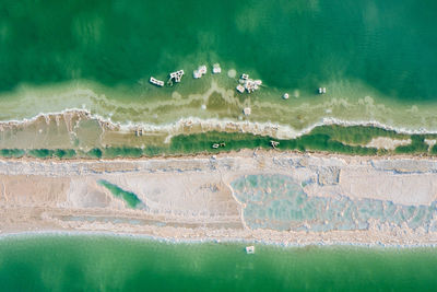 Digital composite image of birds flying over sea