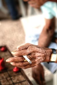 Close-up of man holding mobile phone