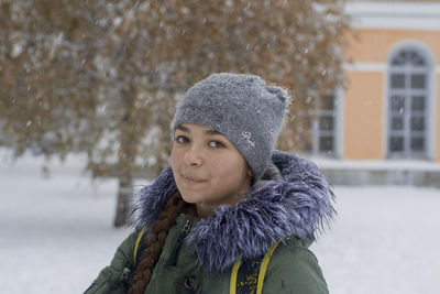 Portrait of girl in winter landscape