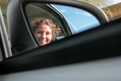 Portrait of woman in car