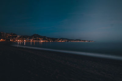 Scenic view of sea against sky at night