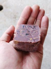 Close-up of hand holding ice cream