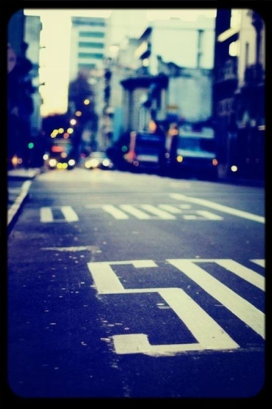 road marking, transportation, road, street, transfer print, car, asphalt, city, the way forward, auto post production filter, building exterior, land vehicle, mode of transport, guidance, city street, road sign, architecture, diminishing perspective, arrow symbol, built structure