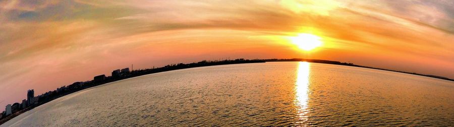 Scenic view of sea at sunset