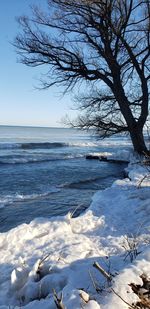 Scenic view of sea against sky during winter