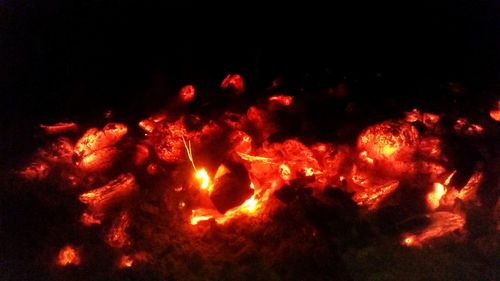 Close-up of fire burning at night