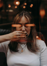 Portrait of woman smoking cigarette