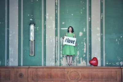 Woman standing by door