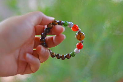 Close-up of hand holding berries