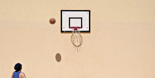 View of man playing basketball
