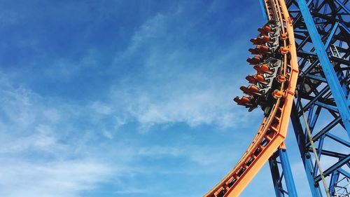 Low angle view of rollercoaster against sky