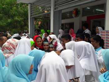 Group of people at market stall