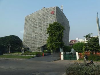 Buildings in city against clear sky