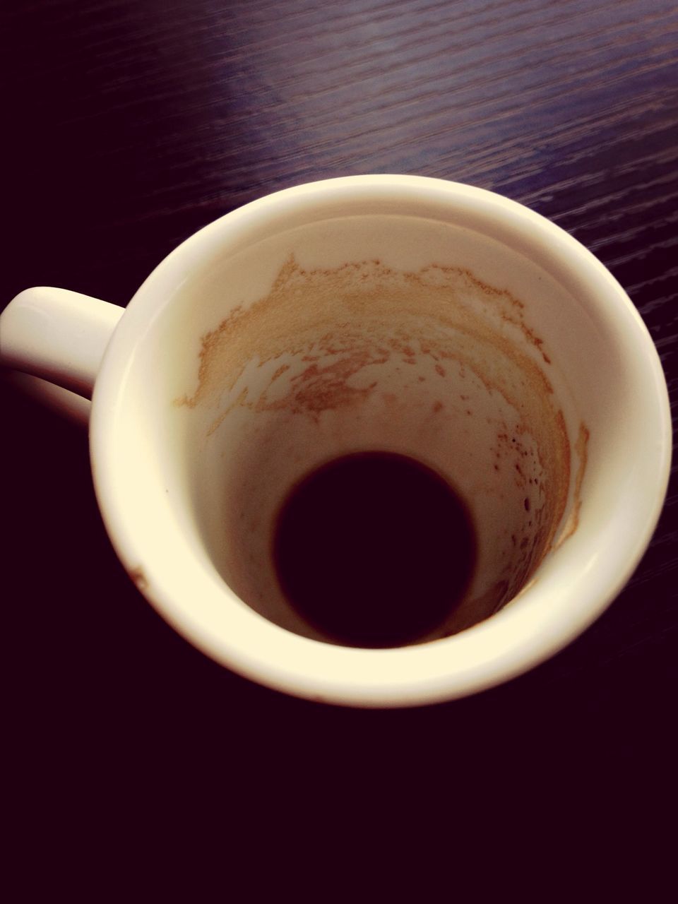 coffee cup, drink, refreshment, food and drink, indoors, saucer, coffee - drink, freshness, cup, coffee, table, still life, high angle view, directly above, spoon, close-up, beverage, tea cup, black coffee, overhead view