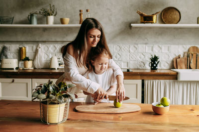 Happy mother and daughter at home