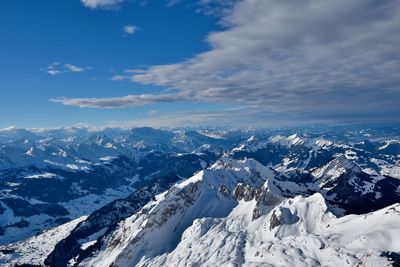 Scenic view of snowcapped mountains against sky