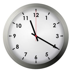 Close-up of clock over white background