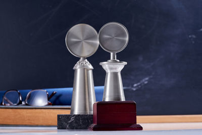 Close-up of clock on table