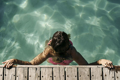 High angle view of man swimming in pool