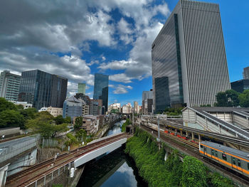 Modern buildings in city against sky