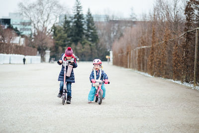 Children riding bicycle on road