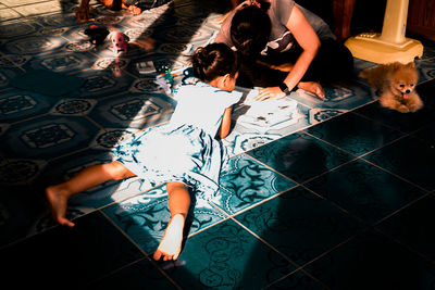 High angle view of people relaxing in swimming pool