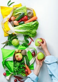 High angle view of man holding fruits