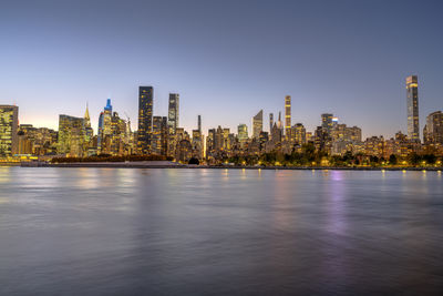 The skyline of midtown manhattan with the chrysler building after sunset