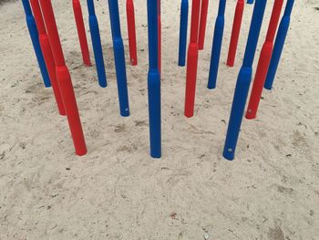 High angle view of multi colored umbrellas on sand