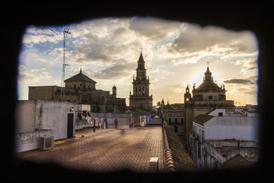 View of buildings in city against sky