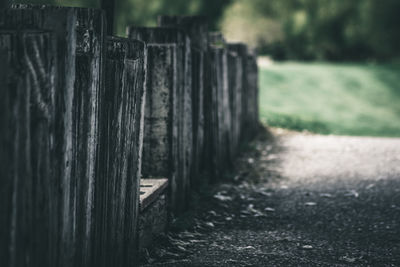 Close-up of wooden fence on field