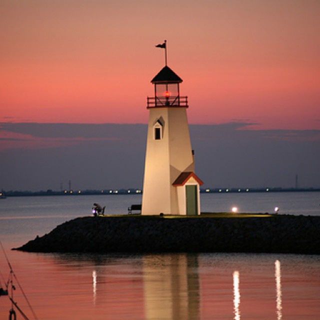 sunset, sea, lighthouse, water, guidance, built structure, sky, architecture, horizon over water, building exterior, orange color, scenics, tranquil scene, tranquility, silhouette, beauty in nature, direction, nature, safety, dusk