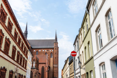 Old houses and st. george church in historic centre of wismar, germany.