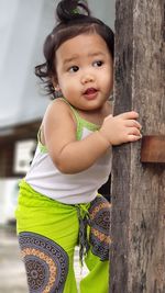 Portrait of cute girl standing outdoors