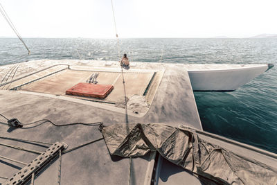 Sailboat sailing in sea against sky