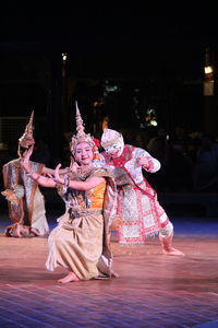 Group of people dancing at night