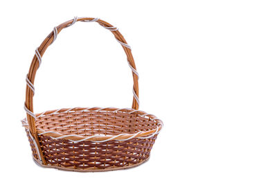 Close-up of wicker basket against white background