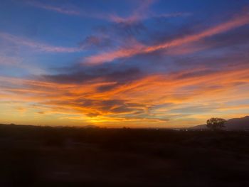 Scenic view of silhouette landscape against sky during sunset