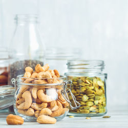 Close-up of food in glass jars on table
