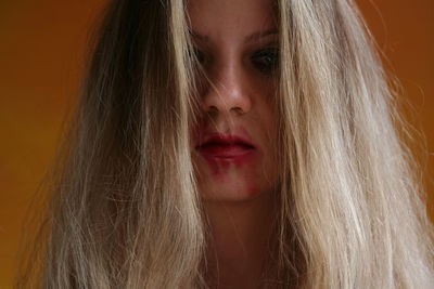 Close-up portrait of woman with smudged make-up