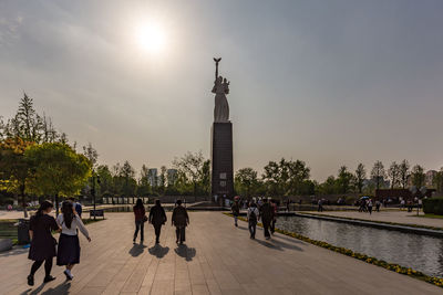 Group of people walking in front of building