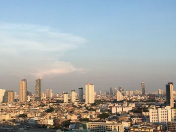 Cityscape against sky during sunset