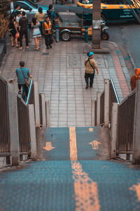 High angle view of people walking on street in city